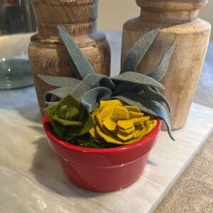Felt succulent arrangement in a red ceramic pot